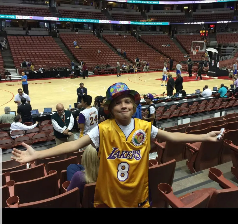 Courtside, one Lakers jersey between them.